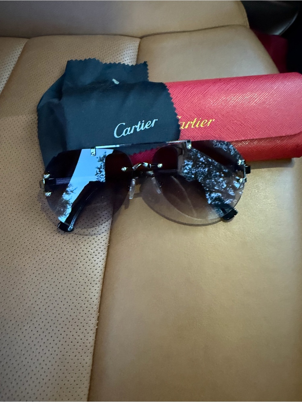 Cartier Women’s Rimless Sunglasses with Black Gradient Lenses and silver Hardwar